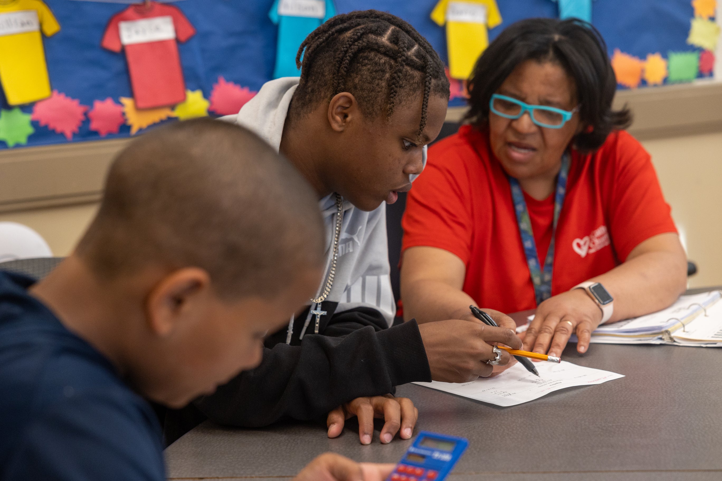 african-american teacher with students